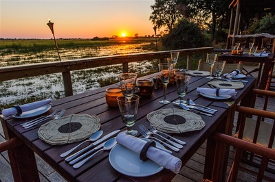 Mombo Camp dinner set-up and view of the lagoon, Botswana