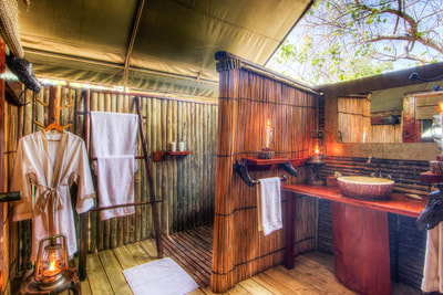 Camp Xakanaxa, bathroom in guest tent