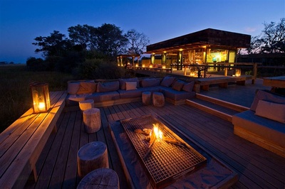 Vumbura Plains Camp firepit and deck in the evening