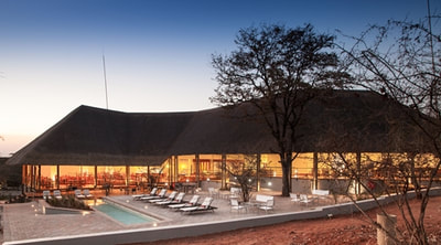 Pool and lounge area at night, Chobe Bush Lodge, Botswana