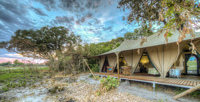 Exterior of luxury tented accommodation at Kadizora Camp, Okavango Delta