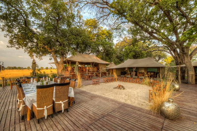 Central area at Kadizora Camp, with outdoor dining, and fire pit