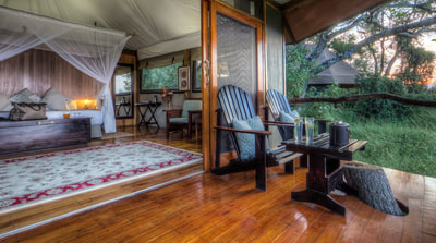 View of private deck and tent interior at Kanana