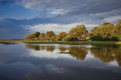 View of Khwai River Lodge from the river, Moremi Game Reserve, Botswana