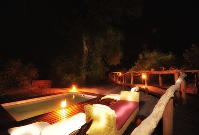 Linyanti Ebony Swimming pool and deck at night