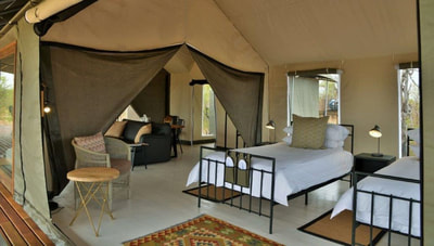 Family tent interior at Nogatsaa Pans Lodge