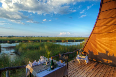 Private dining at Okuti Camp, Moremi Game Reserve, Botswana